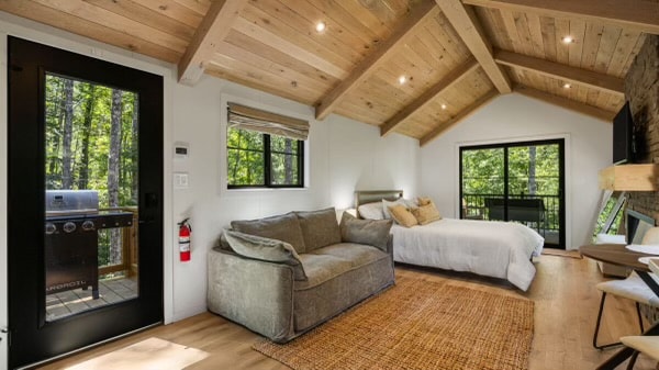 Big Sky interior — vaulted wood beam ceiling, open living space